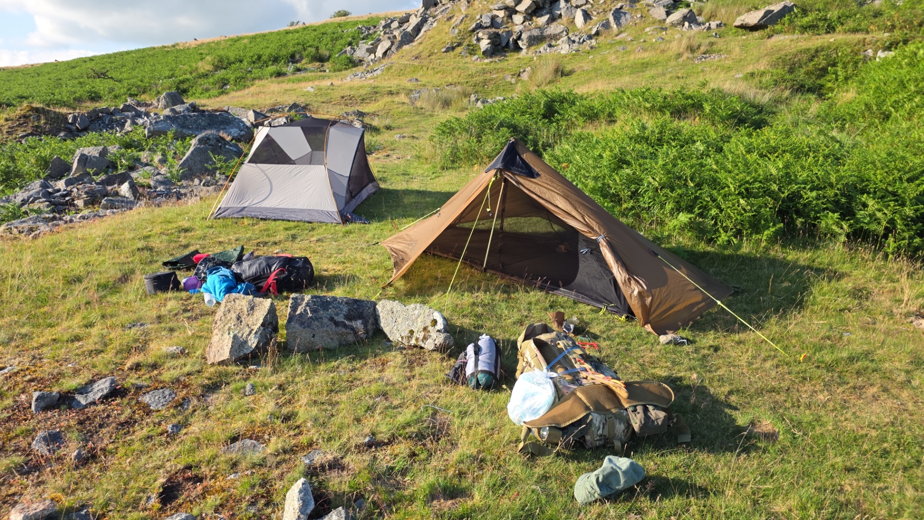 Camp one, just east of Kings Tor. Note the dome tent (his) vs. the pole tent (mine, with commentary).